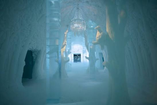 Vaulted hall of packed snow with carved openings along both sides