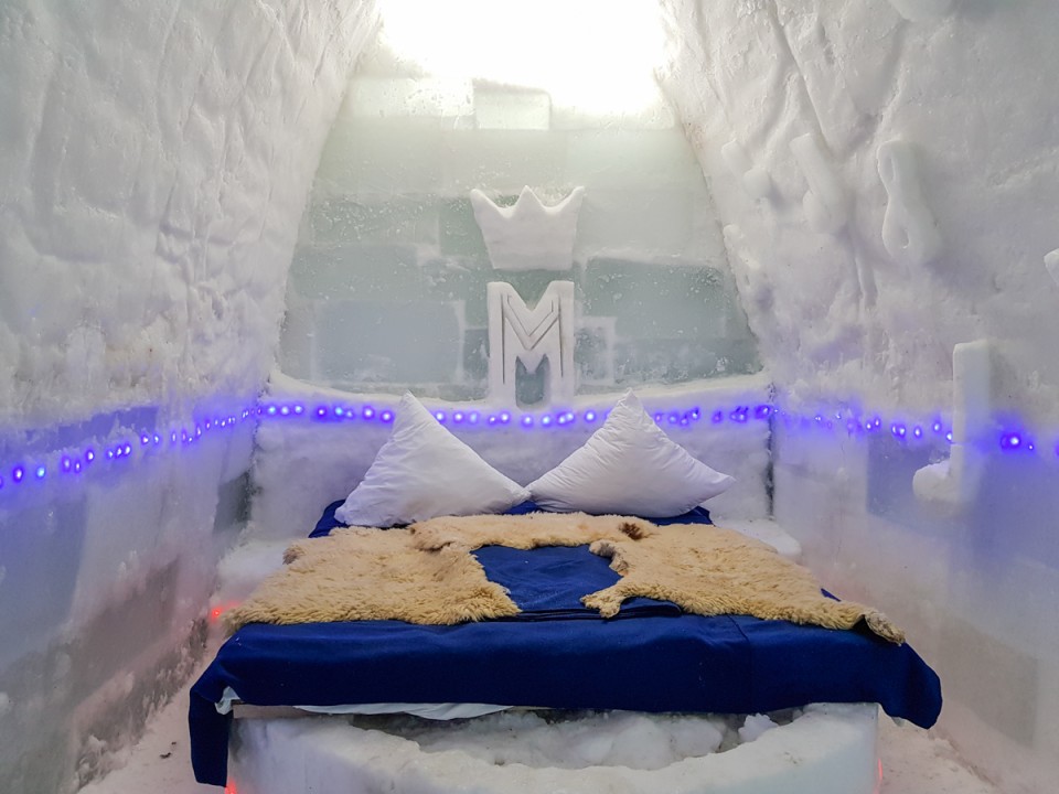 Vaulted chamber of cut ice blocks with a low sleeping platform